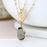 gold-plated-disc-and-smoky-crystal-layered-necklace